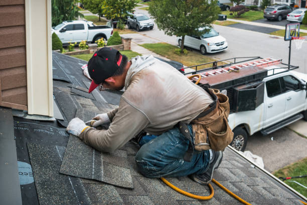 Professional Roof Replacement technician working in Mineola, NY